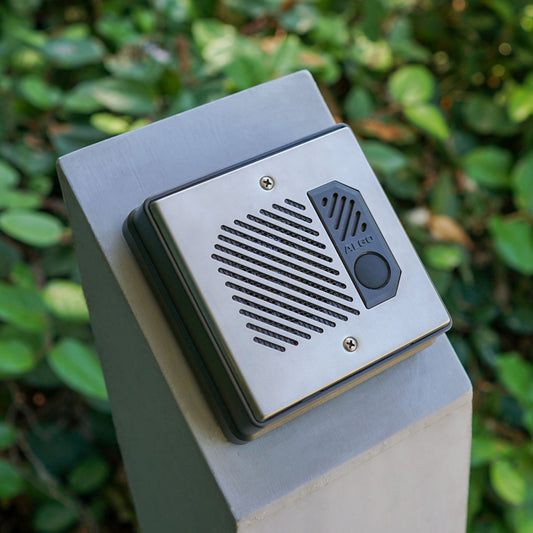 Algo 8201 intercom mounted on a surface, angled to show slim profile and outdoor-ready construction.